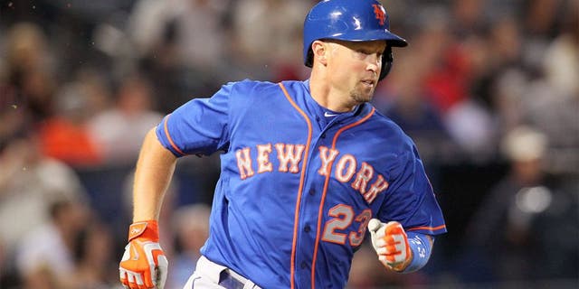 Apr 10, 2015; Atlanta, GA, USA; New York Mets left fielder Michael Cuddyer (23) hits a single against the Atlanta Braves in the fourth inning at Turner Field. Mandatory Credit: Brett Davis-USA TODAY Sports