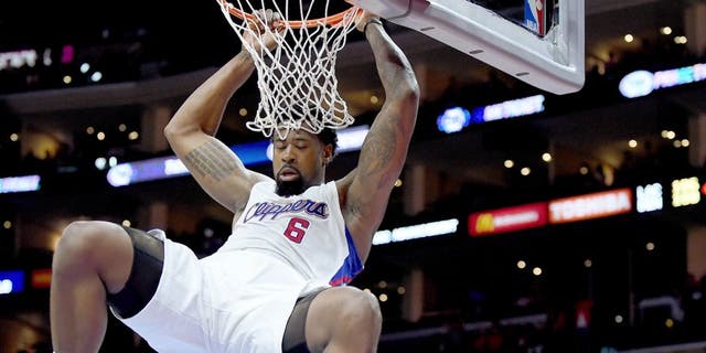 LOS ANGELES, CA - APRIL 13: DeAndre Jordan #6 of the Los Angeles Clippers scores on a dunk in front of Randy Foye #4 of the Denver Nuggets during a 110-103 Clipper win at Staples Center on April 13, 2015 in Los Angeles, California. NOTE TO USER: User expressly acknowledges and agrees that, by downloading and or using this Photograph, user is consenting to the terms and condition of the Getty Images License Agreement. (Photo by Harry How/Getty Images)