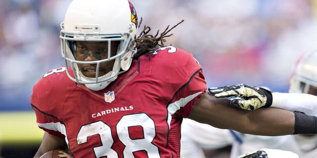 ARLINGTON, TX - NOVEMBER 02: Andre Ellington #38 of the Arizona Cardinals stiff arms Jeff Heath #38 of the Dallas Cowboys at AT&T Stadium on November 2, 2014 in Arlington, Texas. The Cardinals defeated the Cowboys 28-17. (Photo by Wesley Hitt/Getty Images)