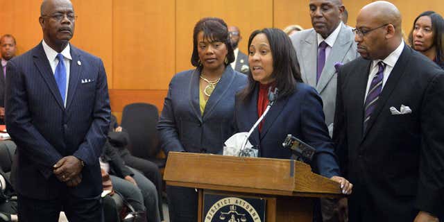 April 14, 2015: Prosecutors Fani Willis and Clint Rucker speak during a news conference following sentencing for 10 of the 11 defendants convicted in the Atlanta Public Schools test-cheating trial