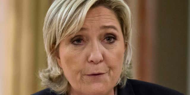 FILE - In this March 13, 2017 file photo, French far-right presidential candidate Marine Le Pen, delivers a speech in Paris.
