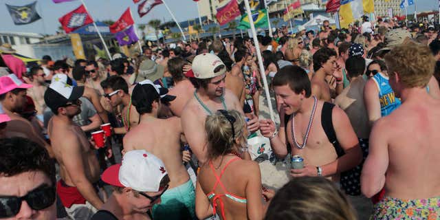 March 25, 2015: Party goers fill the sand behind Club La Vela and Spinnaker Beach Club during the fourth week of spring break.