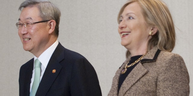 April 16: South Korean Foreign Minister Kim Sung-Hwan, left, walks together with U.S. Secretary of State Hillary Rodham Clinton to a meeting room at the Foreign Minister's Residence in Seoul, South Korea.