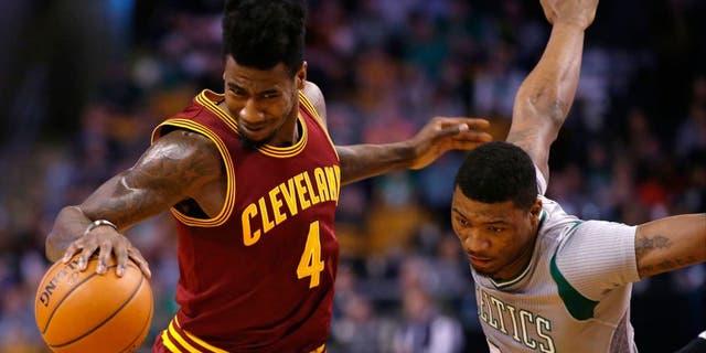 Apr 12, 2015; Boston, MA, USA; Cleveland Cavaliers guard Iman Shumpert (4) works the ball against Boston Celtics guard Marcus Smart (36) in the first half at TD Garden. The Celtics defeated the Cleveland Cavaliers 117-78. (David Butler II-USA TODAY Sports)