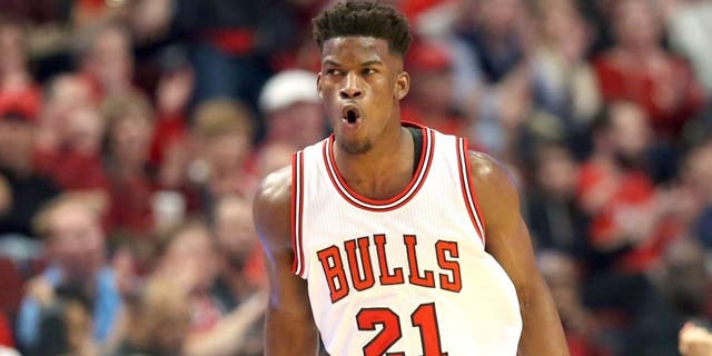 Apr 18, 2015; Chicago, IL, USA; Chicago Bulls guard Jimmy Butler (21) reacts after making a three-point basket against the Milwaukee Bucks during the first quarter in game one of the first round of the 2015 NBA Playoffs at United Center. Mandatory Credit: Jerry Lai-USA TODAY Sports