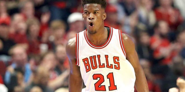 Apr 18, 2015; Chicago, IL, USA; Chicago Bulls guard Jimmy Butler (21) reacts after making a three-point basket against the Milwaukee Bucks during the first quarter in game one of the first round of the 2015 NBA Playoffs at United Center. Mandatory Credit: Jerry Lai-USA TODAY Sports