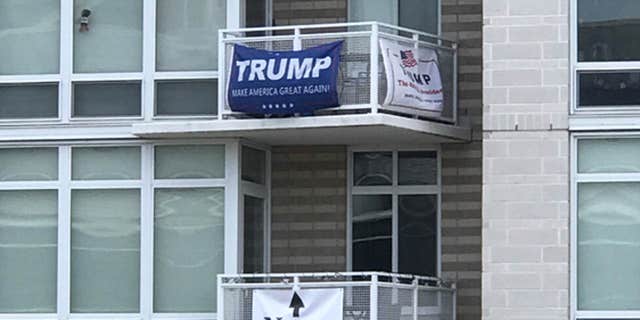 A political rivalry between neighbors at a Southwest D.C. apartment building caught the attention of Washington Nationals fans over the weekend.
