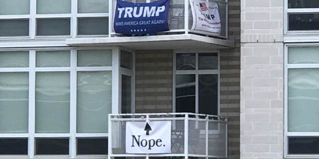 A political rivalry between neighbors at a Southwest D.C. apartment building caught the attention of Washington Nationals fans over the weekend.