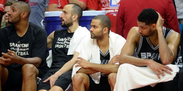 Apr 19, 2015; Los Angeles, CA, USA; San Antonio Spurs center Boris Diaw (33), guard Tony Parker (9), guard Manu Ginobili (20), guard Tony Parker (9) and forward Tim Duncan (21) during the fourth quarter against the Los Angeles Clippers in game one of the first round of the NBA Playoffs at Staples Center. Mandatory Credit: Richard Mackson-USA TODAY Sports
