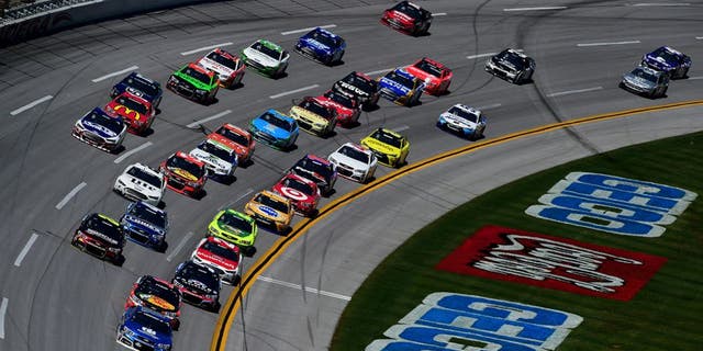 TALLADEGA, AL - MAY 03: Dale Earnhardt Jr., driver of the #88 Nationwide Chevrolet, leads a pack of cars during the NASCAR Sprint Cup Series GEICO 500 at Talladega Superspeedway on May 3, 2015 in Talladega, Alabama. (Photo by Jared C. Tilton/Getty Images)