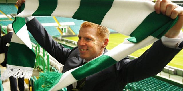 June 9, 2010: Celtic football team's new manager Neil Lennon poses with a club scarf after a press conference announcing his appointment, at Celtic Park stadium in Glasgow, Scotland.