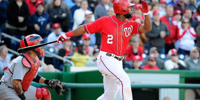 Apr 20, 2014; Washington, DC, USA; Washington Nationals center fielder Denard Span (2) hits a walk off RBI sacrifice fly against the St. Louis Cardinals during the ninth inning at Nationals Park. The Nationals won 3-2. Mandatory Credit: Brad Mills-USA TODAY Sports