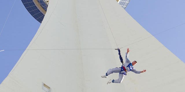 Sr. Master Sgt. Darryl LeBouef jumps from the 108th floor of the Stratosphere Casino, Hotel and Tower in Las Vegas, Nevada, Tuesday, April 20, 2010, during the Grand Opening of SkyJump Las Vegas. LeBouef’s 855-ft leap officially set a Guinness World Record for highest commercial decelerated descent.