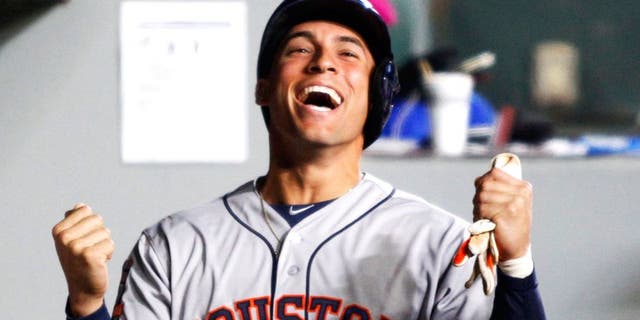 Apr 21, 2015; Seattle, WA, USA; Houston Astros right fielder George Springer (4) celebrates his RBI-sacrifice fly against the Seattle Mariners during the third inning at Safeco Field. Mandatory Credit: Joe Nicholson-USA TODAY Sports
