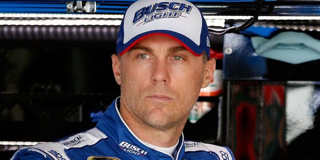 during practice for the NASCAR Sprint Cup Series TOYOTA OWNERS 400 at Richmond International Raceway on April 22, 2016 in Richmond, Virginia.,RICHMOND, VA - APRIL 22: Kevin Harvick, driver of the #4 Busch Light Chevrolet, stands in the garage area during practice for the NASCAR Sprint Cup Series TOYOTA OWNERS 400 at Richmond International Raceway on April 22, 2016 in Richmond, Virginia. (Photo by Todd Warshaw/Getty Images)