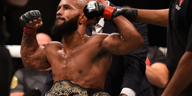 LAS VEGAS, NV - SEPTEMBER 05: Demetrious Johnson reacts after his victory over John Dodson in their flyweight championship bout during the UFC 191 event inside MGM Grand Garden Arena on September 5, 2015 in Las Vegas, Nevada. (Photo by Jeff Bottari/Zuffa LLC/Zuffa LLC via Getty Images)