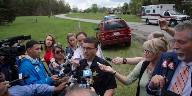 Lt. Michael Preston, of the Ross County Sheriff's Department speaks to the media on Union Hill Road that approaches a crime scene, Friday, April 22, 2016, in Pike County, Ohio.