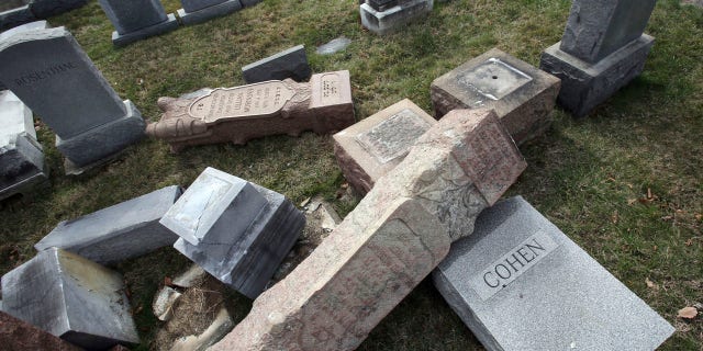 Monday, Feb. 27, 2017: Toppled and damaged headstones rest on the ground at Mount Carmel Cemetery in Philadelphia. The Anti-Defamation League found an increase in cases of anti-Semitic intimidation and vandalism in 2016, evidence that anti-Jewish bias intensified during the election.