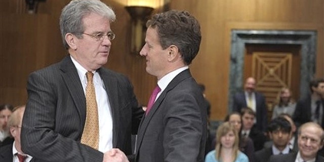 Feb. 16: Senate Finance Committee member Sen. Tom Coburn, R-Okla. , left., talks with Treasury Secretary Timothy Geithner on Capitol Hill in Washington.