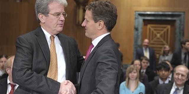 Feb. 16: Senate Finance Committee member Sen. Tom Coburn, R-Okla. , left., talks with Treasury Secretary Timothy Geithner on Capitol Hill in Washington.