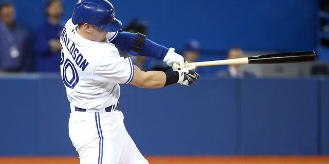TORONTO, CANADA - APRIL 23: Josh Donaldson #36 of the Toronto Blue Jays hits a two-run home run in the third inning during MLB game action against the Baltimore Orioles on April 23, 2015 at Rogers Centre in Toronto, Ontario, Canada. (Photo by Tom Szczerbowski/Getty Images)