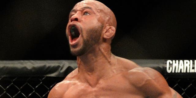 SEATTLE, WA - JULY 27: Demetrious Johnson celebrates his victory over John Moraga in their flyweight championship bout during the UFC on FOX event at Key Arena on July 27, 2013 in Seattle, Washington. (Photo by Jeff Bottari/Zuffa LLC/Zuffa LLC via Getty Images)