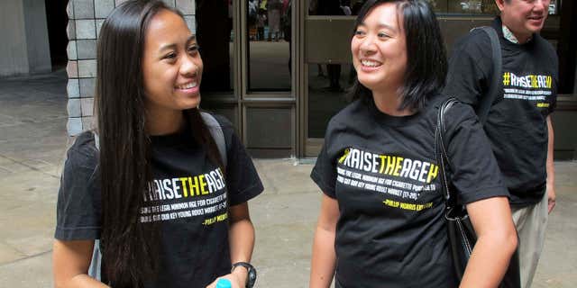 April 24, 2015: Sabrina Olaes, left, a high school senior who supports raising the legal smoking age, reacts with Lyndsey Garcia, center, of the Coalition for a Tobacco-Free Hawaii and Cory Chun of the American Cancer Society Cancer Action Network outside the Hawaii Legislature after it passed a bill to raise the legal smoking age to 21.