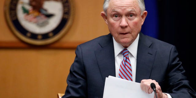In this April 18, 2017 file photo Attorney General Jeff Sessions prepares to speak before a meeting of the Attorney General's Organized Crime Council and Organized Crime Drug Enforcement Task Forces (OCDETF) Executive Committee to discuss implementation of the President's Executive Order 13773, at the Department of Justice in Washington.
