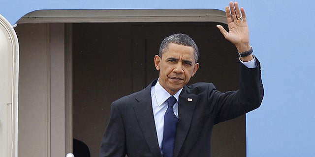 April 22: President Obama waves upon his arrival at Andrews Air Force Base, Md.