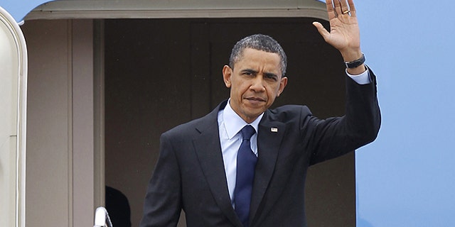 April 22: President Obama waves upon his arrival at Andrews Air Force Base, Md.