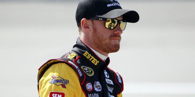 RICHMOND, VA - APRIL 24: Jeb Burton, driver of the #26 Estes Express Lines Toyota, stands on the grid during practice for the NASCAR Sprint Cup Series Toyota Owners 400 at Richmond International Raceway on April 24, 2015 in Richmond, Virginia. (Photo by Brian Lawdermilk/NASCAR via Getty Images)