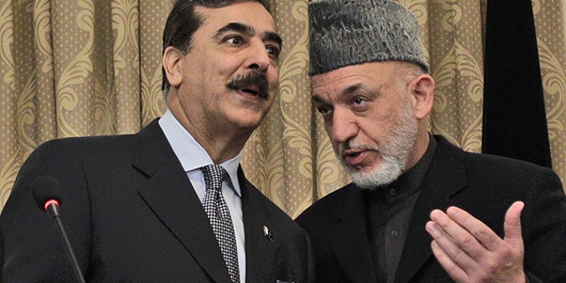April 16: Pakistan's Prime Minister Raza Gilani, left, speaks with Afghanistan's President Hamid Karzai during a news conference in Kabul, Afghanistan.