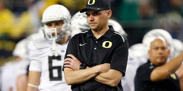 ARLINGTON, TX - JANUARY 12: Head coach Mark Helfrich of the Oregon Ducks looks on against the Ohio State Buckeyes during the College Football Playoff National Championship Game at AT&T Stadium on January 12, 2015 in Arlington, Texas. (Photo by Christian Petersen/Getty Images)