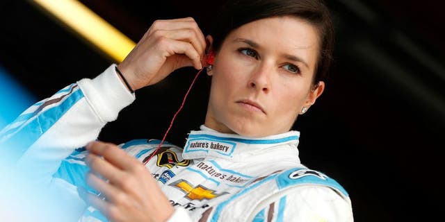 RICHMOND, VA - APRIL 22: Danica Patrick, driver of the #10 Nature's Bakery Chevrolet, stands in the garage area during practice for the NASCAR Sprint Cup Series TOYOTA OWNERS 400 at Richmond International Raceway on April 22, 2016 in Richmond, Virginia. (Photo by Brian Lawdermilk/Getty Images)