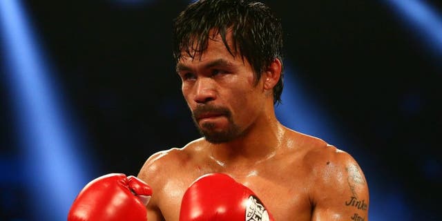 April 9, 2016; Las Vegas, NV, USA; Manny Pacquiao fights against Timothy Bradley at MGM Grand Garden Arena. Mandatory Credit: Mark J. Rebilas-USA TODAY Sports