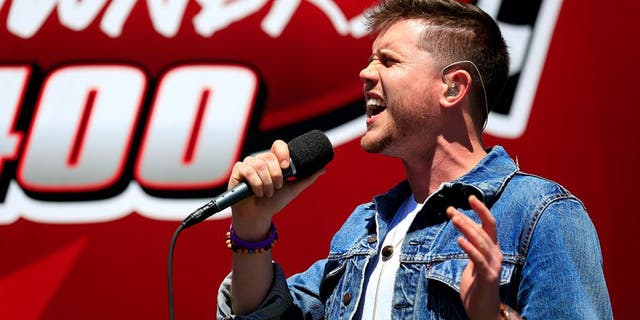 RICHMOND, VA - APRIL 24: Country music singer and American Idol winner Trent Harmon performs the national anthem prior to the NASCAR Sprint Cup Series TOYOTA OWNERS 400 at Richmond International Raceway on April 24, 2016 in Richmond, Virginia. (Photo by Daniel Shirey/NASCAR via Getty Images)