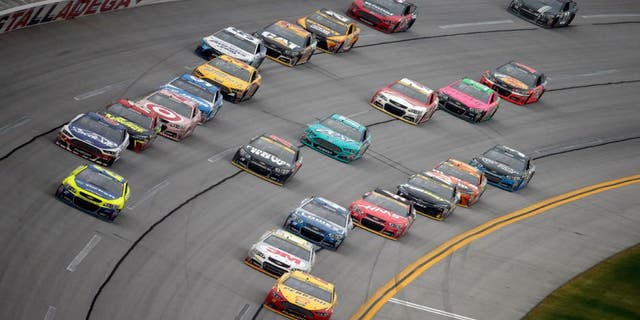 TALLADEGA, AL - OCTOBER 25: Joey Logano, driver of the #22 Shell Pennzoil Ford, leads the field during the NASCAR Sprint Cup Series CampingWorld.com 500 at Talladega Superspeedway on October 25, 2015 in Talladega, Alabama. (Photo by Brian Lawdermilk/Getty Images)