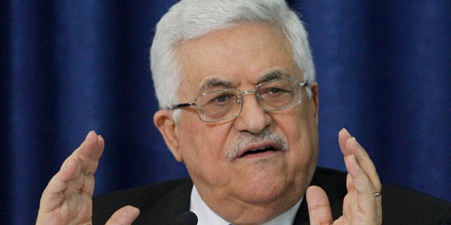 April 28: Palestinian President Mahmoud Abbas gestures as he speaks during a press conference with members of the Israeli Peace Initiative in Ramallah.