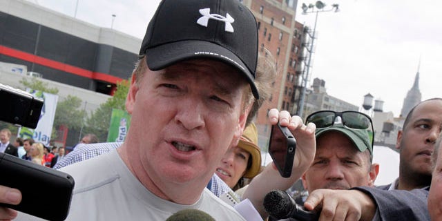 April 27: National Football League commissioner Roger Goodell is surrounded by media at an NFL predraft event in New York.