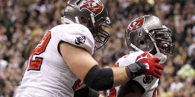 Jan. 2: Tampa Bay Buccaneers wide receiver Mike Williams (19) celebrates with center Ted Larsen (62) after scoring a touchdown during the third quarter of their NFL football game in New Orleans, La.