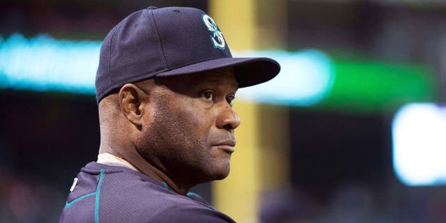 Apr 27, 2015; Arlington, TX, USA; Seattle Mariners manager Lloyd McClendon (21) watches his team take on the Texas Rangers at Globe Life Park in Arlington. Mandatory Credit: Jerome Miron-USA TODAY Sports