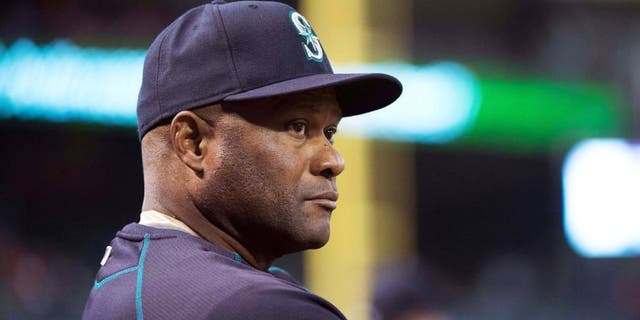 Apr 27, 2015; Arlington, TX, USA; Seattle Mariners manager Lloyd McClendon (21) watches his team take on the Texas Rangers at Globe Life Park in Arlington. Mandatory Credit: Jerome Miron-USA TODAY Sports