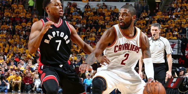 CLEVELAND, OH - MAY 17: Kyrie Irving #2 of the Cleveland Cavaliers handles the ball against the Toronto Raptors in Game One of the Eastern Conference Finals during the 2016 NBA Playoffs on May 17, 2016 at Quicken Loans Arena in Cleveland, Ohio. NOTE TO USER: User expressly acknowledges and agrees that, by downloading and or using this Photograph, user is consenting to the terms and conditions of the Getty Images License Agreement. Mandatory Copyright Notice: Copyright 2016 NBAE (Photo by Nathaniel S. Butler/NBAE via Getty Images)