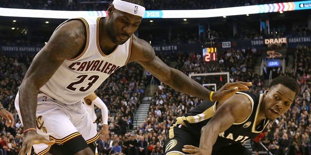 TORONTO, ON - NOVEMBER 25: LeBron James #23 of the Cleveland Cavaliers defends against Kyle Lowry #7 of the Toronto Raptors on November 25, 2015 at Air Canada Centre in Toronto, Ontario, Canada. NOTE TO USER: User expressly acknowledges and agrees that, by downloading and or using this photograph, User is consenting to the terms and conditions of the Getty Images License Agreement. Mandatory Copyright Notice: Copyright 2015 NBAE (Photo by Dave Sandford/NBAE via Getty Images)