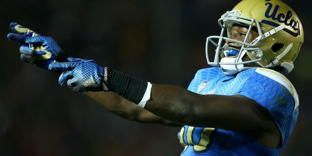 the USC Trojans the UCLA Bruins at the Rose Bowl on November 22, 2014 in Pasadena, California. (Photo by Stephen Dunn/Getty Images),PASADENA, CA - NOVEMBER 22: Linebacker Myles Jack #30 of the UCLA Bruins celebrates after the Bruins stopped the USC Trojans on fourth down on the five yard line to take over on downs on the final play of the first quarter at the Rose Bowl on November 22, 2014 in Pasadena, California. (Photo by Stephen Dunn/Getty Images)
