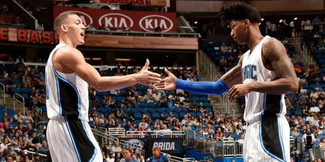 ORLANDO, FL - APRIL 3: Elfrid Payton #4 of the Orlando Magic shakes hands with Aaron Gordon #00 of the Orlando Magic during the game against the Memphis Grizzlies on April 3, 2016 at Amway Center in Orlando, Florida. NOTE TO USER: User expressly acknowledges and agrees that, by downloading and or using this photograph, User is consenting to the terms and conditions of the Getty Images License Agreement. Mandatory Copyright Notice: Copyright 2016 NBAE (Photo by Fernando Medina/NBAE via Getty Images)