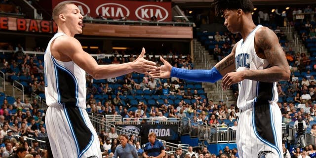 ORLANDO, FL - APRIL 3: Elfrid Payton #4 of the Orlando Magic shakes hands with Aaron Gordon #00 of the Orlando Magic during the game against the Memphis Grizzlies on April 3, 2016 at Amway Center in Orlando, Florida. NOTE TO USER: User expressly acknowledges and agrees that, by downloading and or using this photograph, User is consenting to the terms and conditions of the Getty Images License Agreement. Mandatory Copyright Notice: Copyright 2016 NBAE (Photo by Fernando Medina/NBAE via Getty Images)