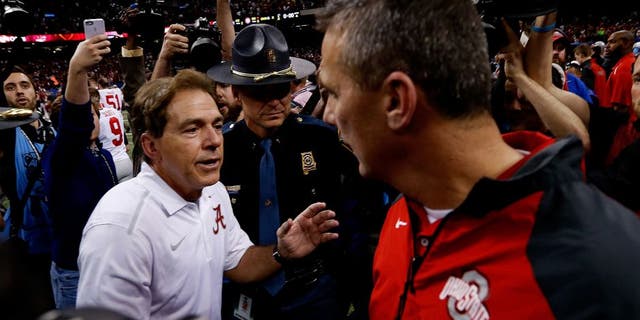 NEW ORLEANS, LA - JANUARY 01: Head coach Urban Meyer (R) of the Ohio State Buckeyes shakes hands with head coach Nick Saban (L) of the Alabama Crimson Tide after the All State Sugar Bowl at the Mercedes-Benz Superdome on January 1, 2015 in New Orleans, Louisiana. The Ohio State Buckeyes defeated the Alabama Crimson Tide 42 to 35. (Photo by Sean Gardner/Getty Images)