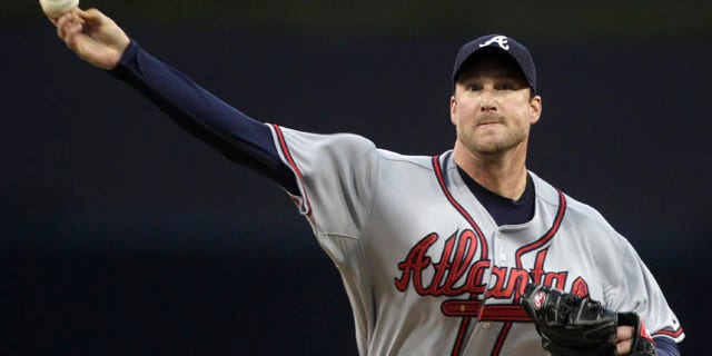 April 25: Atlanta Braves starting pitcher Derek Lowe releases a pitch against the San Diego Padres in the first inning of a baseball game in San Diego.