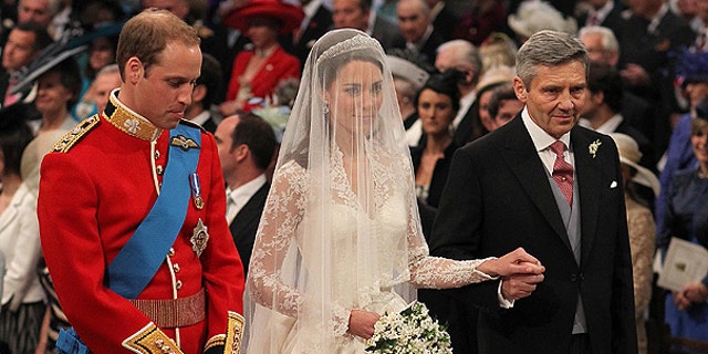 April 29: Britain's Prince William and Kate Middleton, centre, stand at the altar during the service along with Kate's father Michael Middleton.